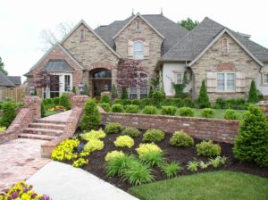 Photo of the front of a beautiful large home with great curb appeal.