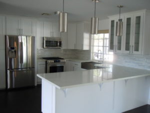 Updated white kitchen for an article about kitchen design choices.