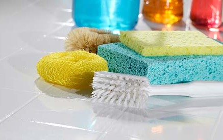 Photo of cleaning supplies on a counter for an article discussing spring cleaning.
