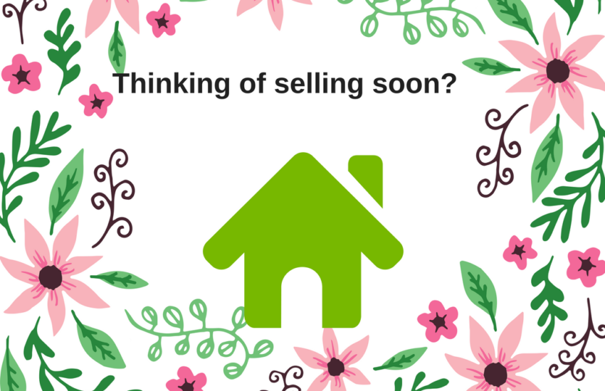 Flowers and a house to illustrate the spring real estate market.