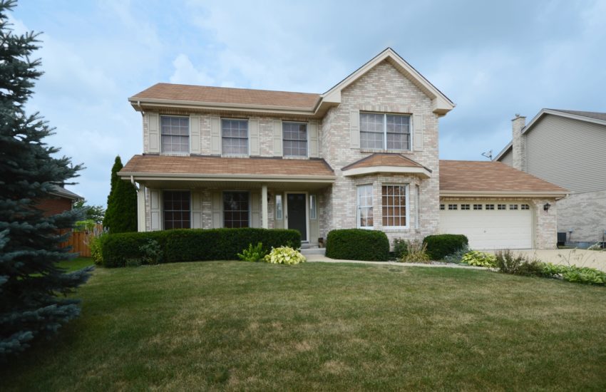 The exterior of a 4 bedroom home for sale in Farmingdale Village.