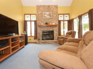 Grand family room with fireplace in 22826 S Kathey Drive Channahon.