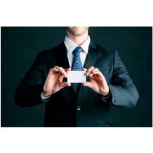 Man in a suit holding up a business card for business networking which is another free local event happening soon.