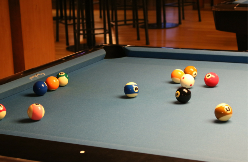 Photo of a pool table for an article about free local events happening soon including the grand opening of a bar.