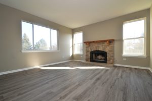 Family room with a fireplace in 3818 Spring Lake Court Joliet.