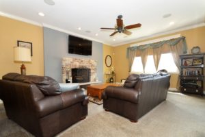 Light and bright family room with a fireplace of 25538 Prairiewood Lane Shorewood.