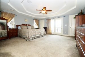 Luxury master bedroom of 25538 Prairiewood Lane Shorewood.