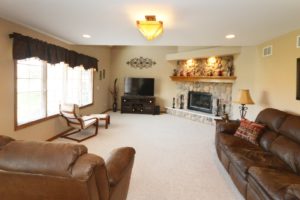 Family room with fireplace in 527 N Raven Road Shorewood.