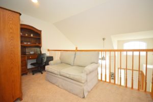 Loft area overlooking the living room of 651 Meadowdale Drive Romeoville.