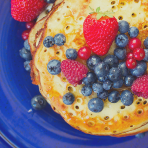 Photo of pancakes with fruit on them for an article about Easter brunch places.