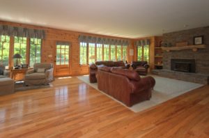 The family room with fireplace of 7765 Pine Bluff Road Morris.