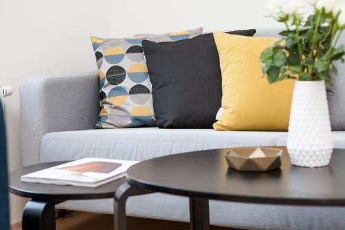 Couch with colorful pillows; it's a good example of nice home staging accessories.