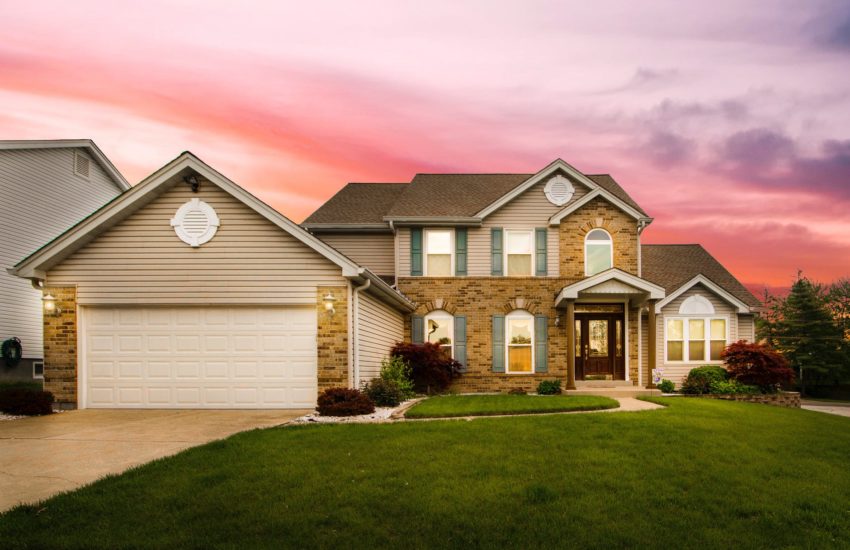 Home with a gorgeous sunset behind it; there are many FAQ for home sellers.