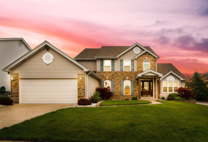 Home against a beautiful sunset; now's a great time to buy a home because of low mortgage rates.