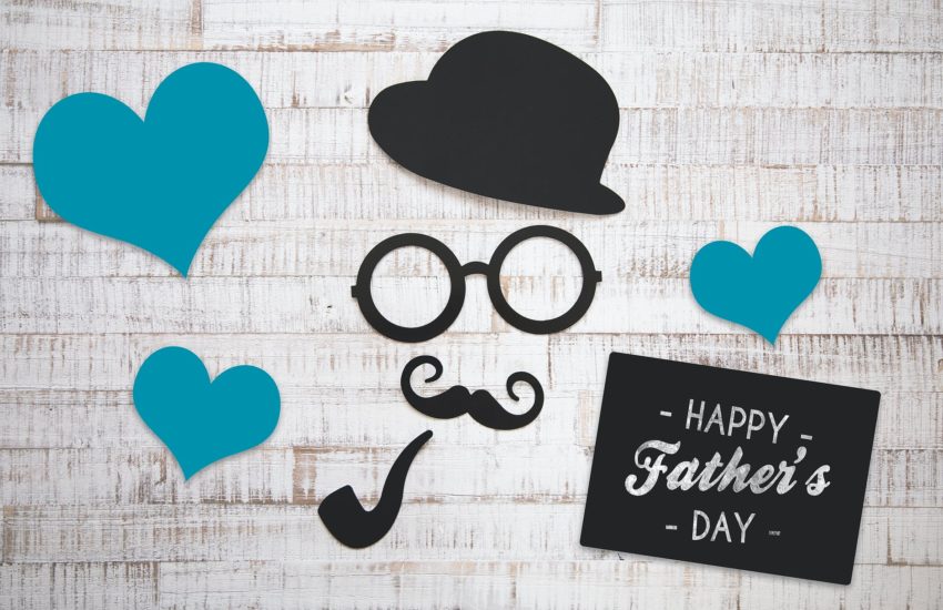 Happy Father's Day 2020 sign with hearts and a face.