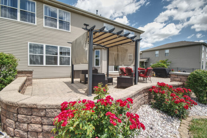 Large back patio with pergola located at 16201 Carlow Manhattan.