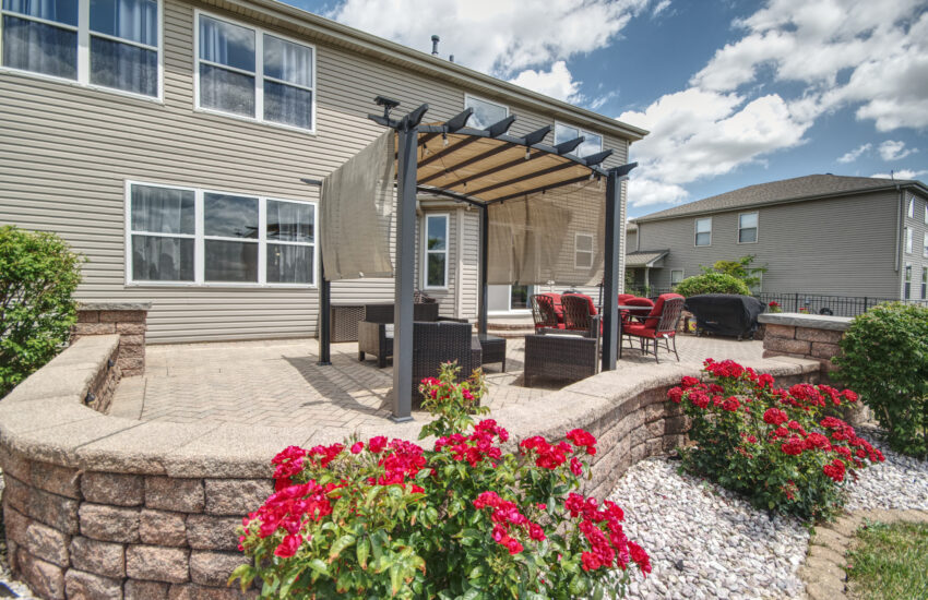 Large back patio with pergola located at 16201 Carlow Manhattan.