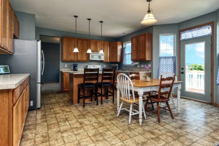 The eat in kitchen with a bay window & patio door located in Shoreood in the Walnet Trails subdivision.