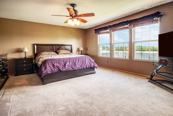 Master Bedroom with ceiling fan in Walnet Trails home.