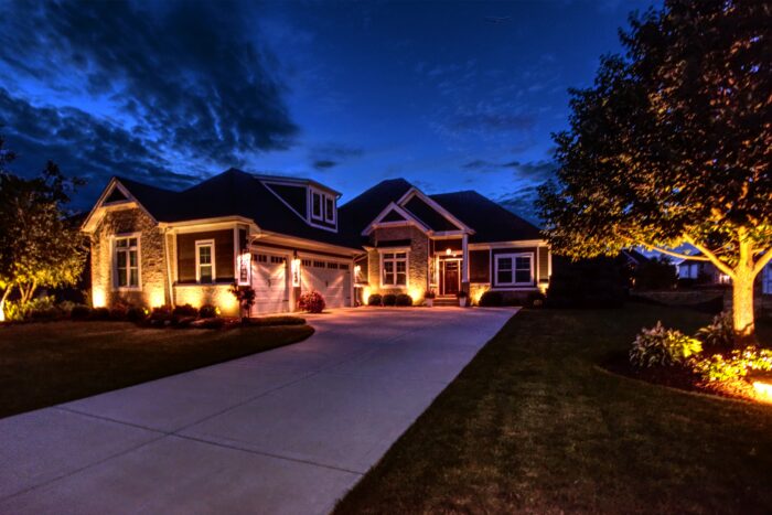 Nightime shot with home lit up at 24444 River Crossing Shorewood.